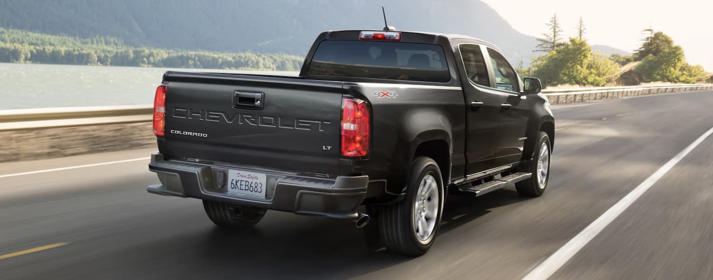 A black 2022 Chevy Colorado is shown from the rear after leaving a Chevrolet Colorado dealer.
