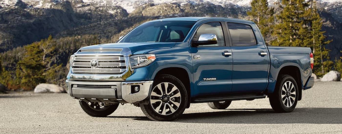 A blue 2020 Toyota Tundra is shown from the side after leaving a used truck dealership.