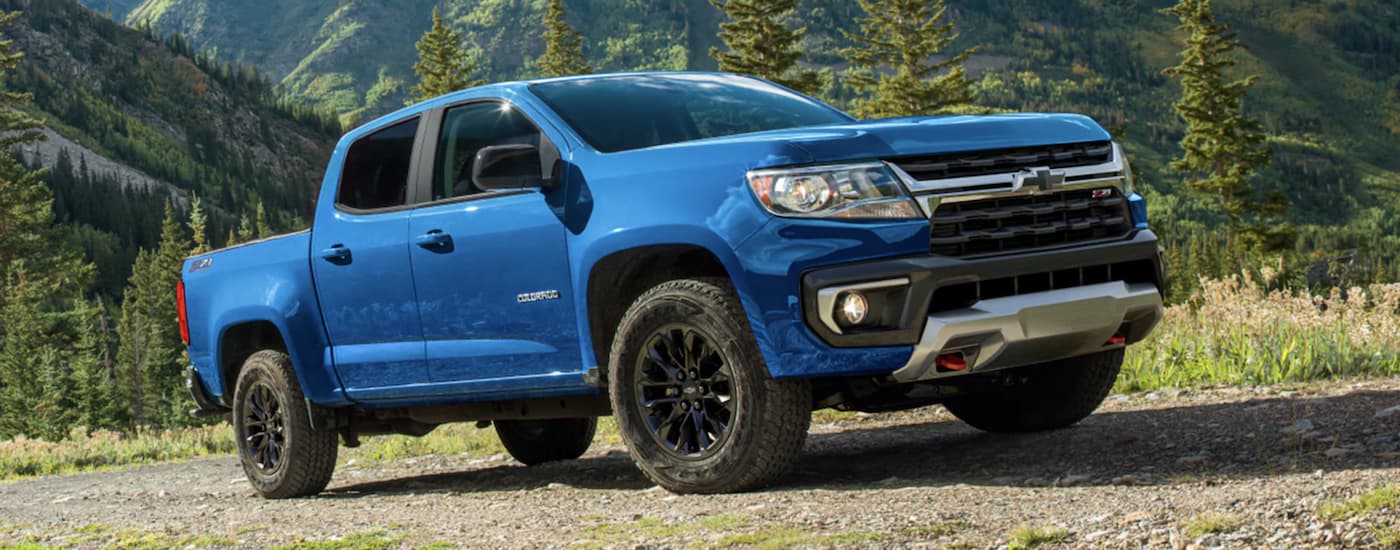 A blue 2022 Chevy Colorado is shown from the side parked in a field after leaving a Oklahoma Chevy dealer.