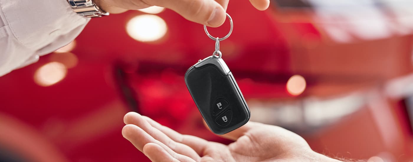A car key is shown being passed to a salesperson after someone decided to search 