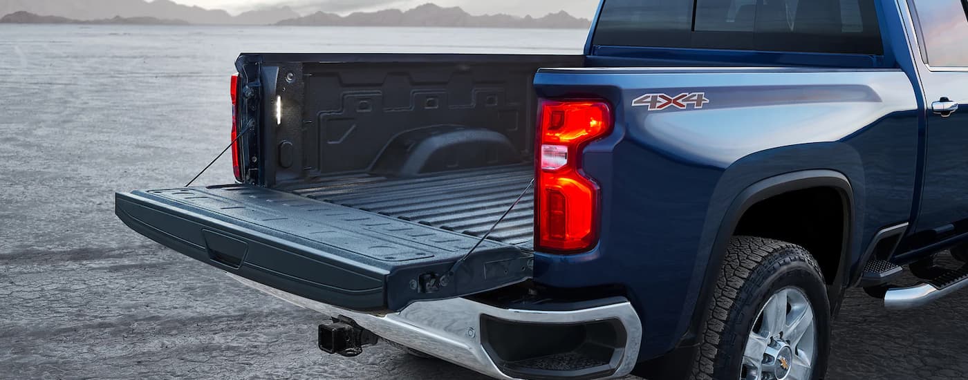 A view of the bed of a blue 2021 Chevy Silverado 1500 WT is shown.
