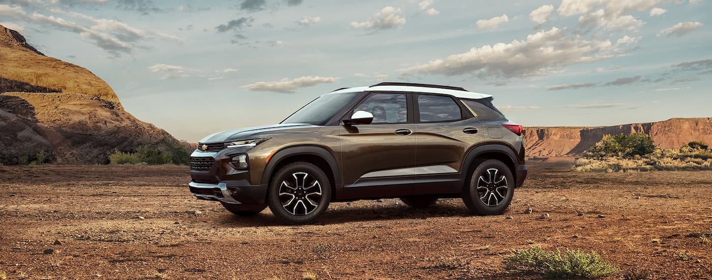 A brown 2022 Chevy Trailblazer is shown parked on a dirt area.