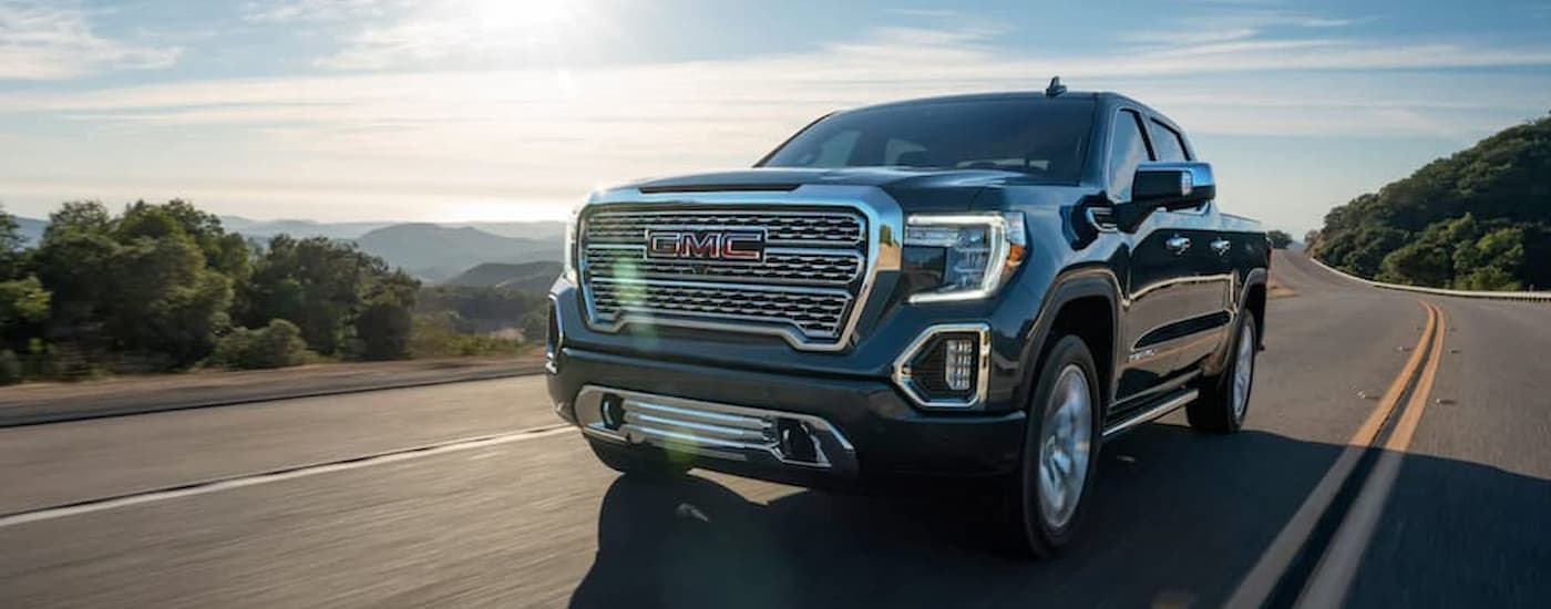 A gret 2020 GMC Sierra 1500 Denali is shown after leaving a used truck dealership.