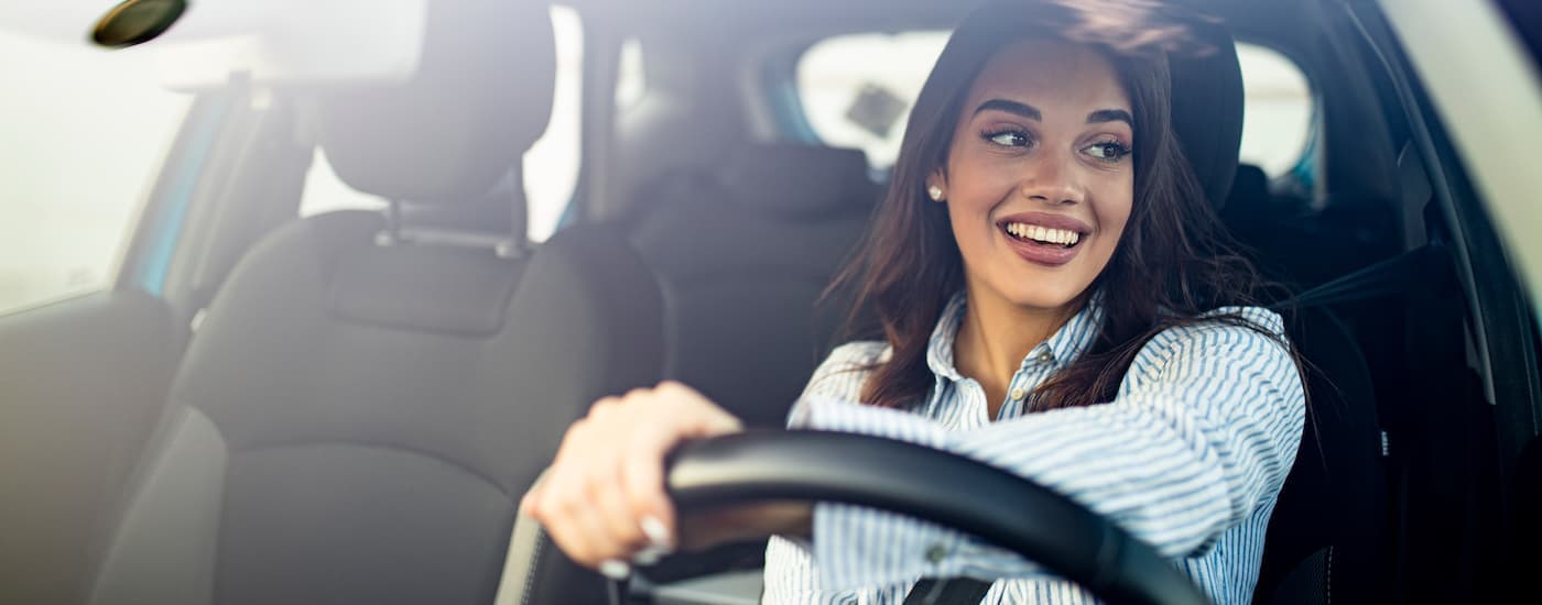 A person is shown driving a clean car after searching 